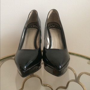 Shiny black wedge heels